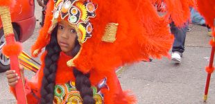 Young Mardi Gras Indian masquerades in his beautiful Indian suit. Photo: Zada Johnson