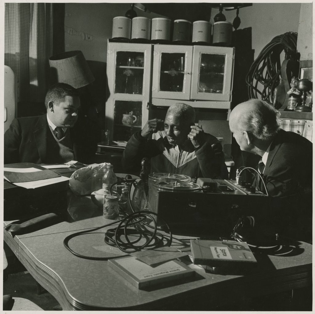 Alcide "Slow Drag" Pavageau with Richard B. Allen and William Russell; during interview for Ford Foundation-910 Burgundy Street (his home); 1958-12-10; Hogan Jazz Archive, Special Collections, Howard-Tilton Memorial Library. Tulane University; Photo Credit: William Simmons