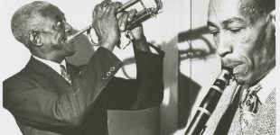 Bunk Johnson Band; George Lewis, cl, with Bunk Johnson, tp; playing a Town Hall concert.; Hogan Jazz Archive Photography Collection; Photo Credit: Skippy Adelman